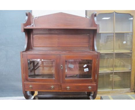 An Early XX Century Mahogany Wall Cabinet, having upper shelf, over glazed cupboard doors and twin drawers, 62cm wide.