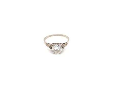 A VINTAGE DIAMOND SOLITAIRE RING, UNHALLMARKED, STAMPED PLAT, ASSESSED AS PLATINUM. THE DIAMOND IN AN EIGHT CLAW SETTING UPON