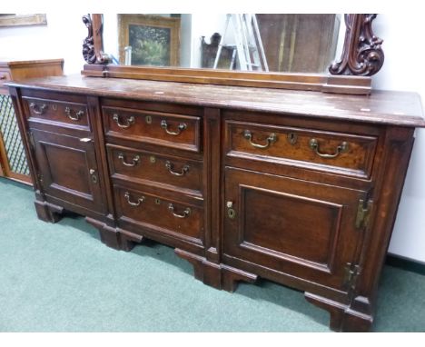 A 19th C.OAK DRESSER, THE THREE CENTRAL GRADED DRAWERS FLANKED BY DRAWERS OVER CUPBOARDS ON BRACKET FEET.   W 199 x D 56 x H 