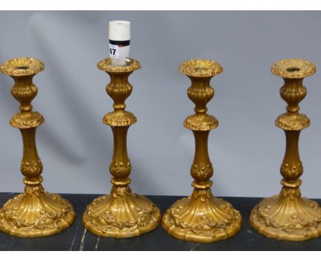 A SET OF FOUR GILT METAL CANDLESTICK TABLE LAMPS WORKED WITH ROCOCO FLOWERS AND FOLIAGE.   H  32cms. TOGETHER WITH A PAIR OF 