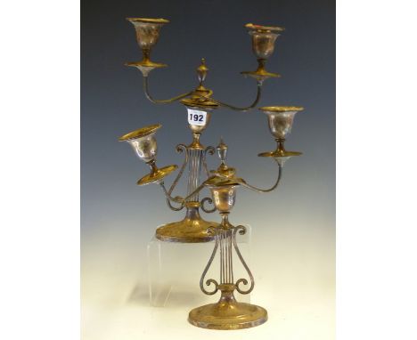 A PAIR OF SILVER TWO LIGHT CANDELABRA BY HARRISON  BROS AND HOWSON, LONDON 1895, THE ARMS REMOVABLE FROM OVAL SCONCES ON LYRE