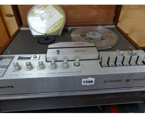 A PHILLIPS STEREO FOUR TRACK TAPE PLAYER AND A MID CENTURY FLOOR STANDING SPOT LIGHT. 