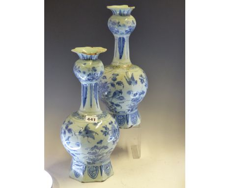 A PAIR OF 18th C. DUTCH DELFT BLUE AND WHITE ONION TOPPED BOTTLE VASES PAINTED WITH BIRDS AND FLOWERS BETWEEN LEAF LAPPET BAN