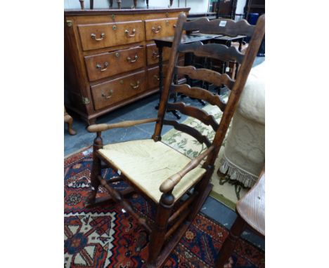A 19th CENTURY LANCASHIRE LADDER BACK ROCKING CHAIR. 