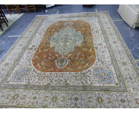 A PERSIAN TABRIZ CARPET. 403 x 312cms