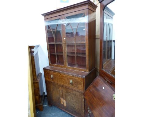 AN EARLY 19th C. MAHOGANY SECRETAIRE BOOKCASE, THE UPPER HALF WITH GLAZED DOORS OVER SHELVES, THE SECRETAIRE DRAWER ABOVE CRO