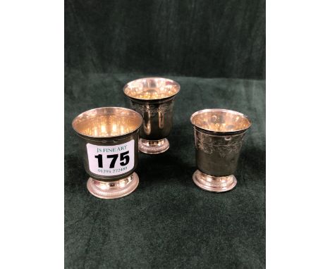 A FRENCH SILVER KIDDUSH CUP BY PUIFORCAT, PARIS, DISCHARGE MARKS, WITH GADROONED FOOT RIM.   H 5cms. TOGETHER WITH TWO OTHER 