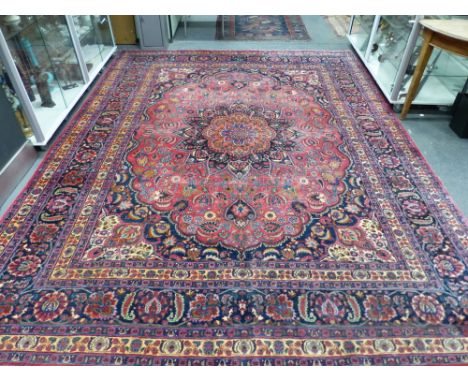 AN ANTIQUE PERSIAN CARPET OF CLASSICAL DESIGN 374 x 272 cm