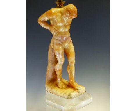 A TWO TONE ALABASTER LAMP CARVED AS A FIGURE OF ATLAS SUPPORTING A GLOBE SHADE ON HIS SHOULDERS, SIGNED G MASCAGNI, THE FIGUR