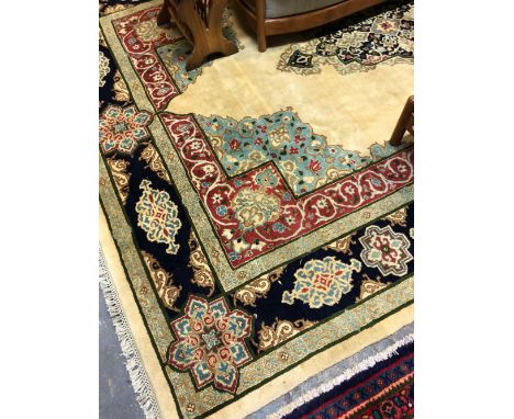 AN ORIENTAL CARPET OF PERISAN TABRIZ DESIGN. 350 x 248cms