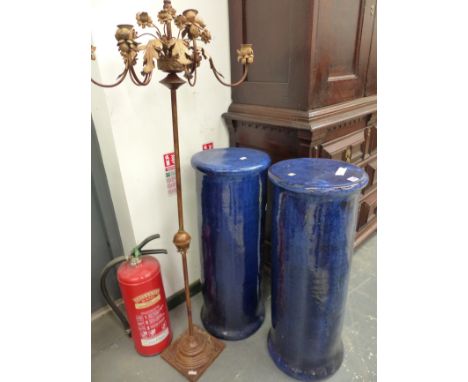 A PAIR OF LARGE BLUE GLAZED POTTERY PEDESTAL AND A CANDELABRA. 