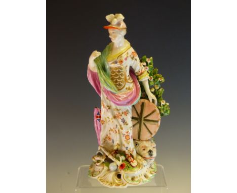 A PATCH MARK DERBY FIGURE OF BRITANNIA STANDING ABOVE A LION RECLINING ON THE BASE  AMONGST TROPHIES OF WAR.   H 28cms. TOGET