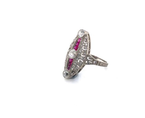 A RUBY AND DIAMOND ART DECO STYLE MARQUISE SHAPED RING. STAMPED PLAT ASSESSED AS PLATINUM. APPROX DIAMOND WEIGHT 0.90cts. FIN