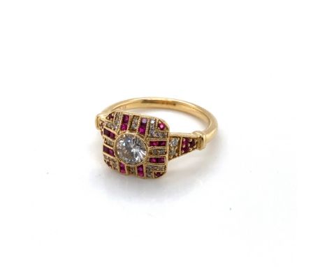 AN 18ct HALLMARKED GOLD DIAMOND AND FANCY CUT RUBY ART DECO STYLE RING. THE CENTRAL DIAMOND DIAMETER 5.0mm. FINGER SIZE L 1/2