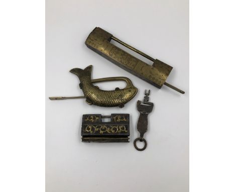 THREE VARIOUS CHINESE PADLOCKS WITH KEYS, ONE WITH GILT SCROLL WORK, ANOTHER IN THE FORM OF A FISH AND THE LARGEST INSCRIBED.