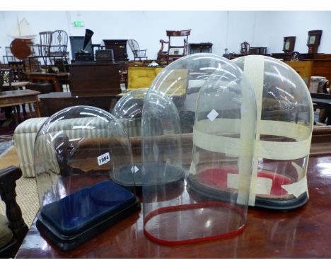 FOUR ANTIQUE GLASS LARGE CLOCK DOMES ON BASES.