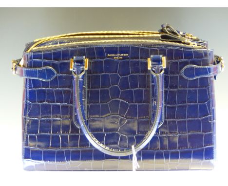 A ASPINAL OF LONDON MIDNIGHT BLUE PATENT CROCODILE EFFECT LEATHER LARGE HANDBAG. L 34 H 25 cms