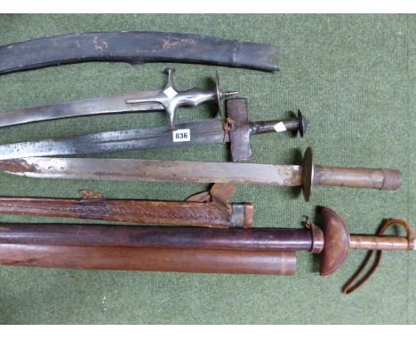 AN INDIAN TULWAR, THE CURVED BLADE STAMPED WITH AN ARSENAL MARK AT THE FORTE, CHARACTERISTIC STEEL HILT WITH LARGE DISC POMME