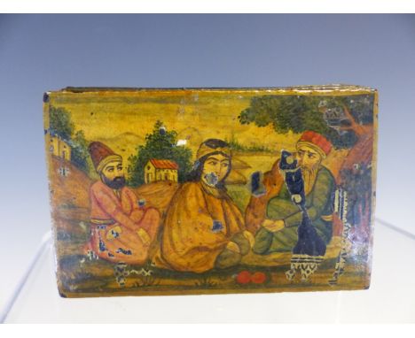 A PERSIAN PAPIER MACHE SNUFF BOX, THE RECTANGULAR LID PAINTED WITH TWO MEN AND A LADY SEATED IN A LANDSCAPE.   W 8.5cms.