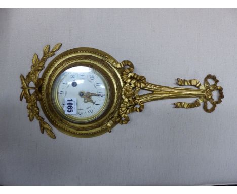 A 19TH CENTURY GILLT BRASS CASED WALL CLOCK WITH STYLISED RIBBON AND FOLIATE DECORATION.EIGHT DAY STRIKING MOVEMENT BY SAMUAL