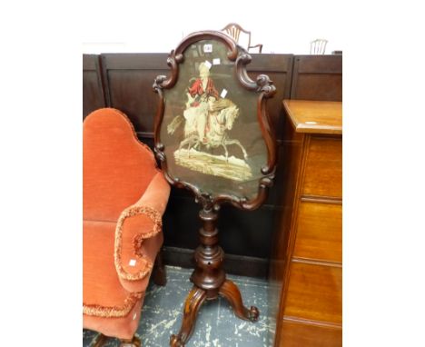 A VICTORIAN CARVED MAHOGANY POLE SCREEN WITH NEEDLE POINT PANEL. 