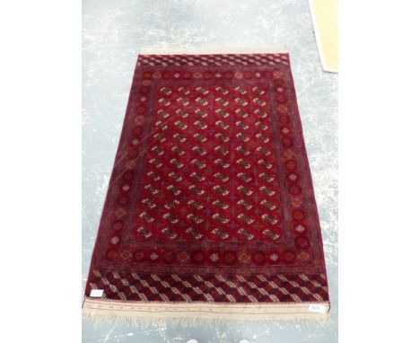 A TEKKE BOKHARA SMALL CARPET. 290 x 187cms