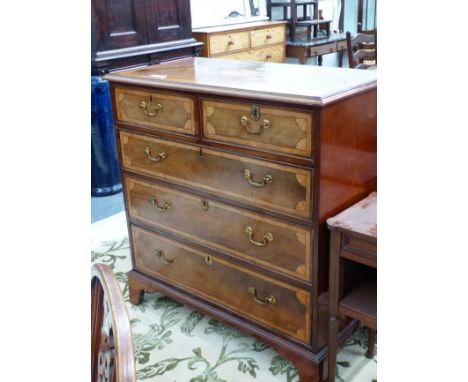 A GEORGE III MAHOGANY AND SATIN WOOD INLAID CHEST OF TWO SHORT AND THREE LONG DRAWERS ON SHAPED BRACKET FEET. H 106 X W 103 X