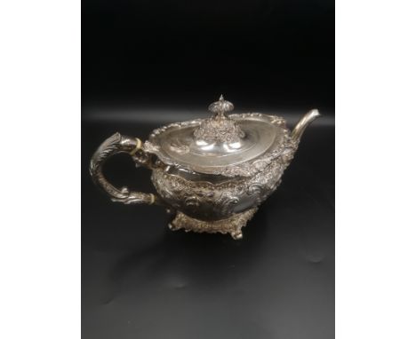 Silver teapot with repousse decoration, 750gms, Glasgow 1901. Estimate: £310-330