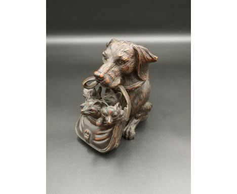19th century Black Forest dog's head inkwell, styled as a dog carrying a basket of puppys, 12cms. Estimate: £200-250