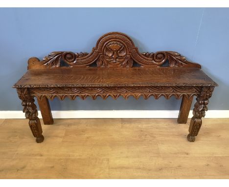 Carved oak hall bench seat, 125 x 30 x 74cms. Estimate £40-60.