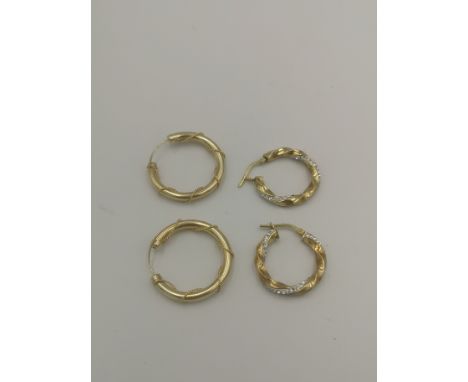 Pair of 9ct gold hoop earrings, 1.8gms; together with a pair of silver and gold plate hoop earrings. Estimate: £30-50