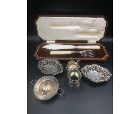 Pair of pierced silver bonbon dishes, Birmingham 1900, 42gms; other items of silver 88gms; a Danish white metal tea strainer;