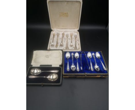 Boxed set (box as found) of six silver teaspoons with matching sugar tongs, 94g, Sheffield 1898; a box containing two silver 