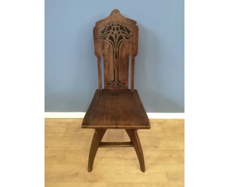 Art Nouveau style hall chair with carved painted panel to back on sabre legs, 44 x 55 x108cms. Estimate £45-80.