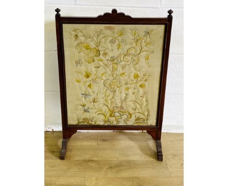 Mahogany fire screen with silk embroidered panel, 59 x 85cms. Estimate £10-30.