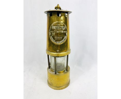 Brass miners lamp by The Protector Lamp and Lighting Co., Eccles Manchester, 24cm. Estimate: £20-40