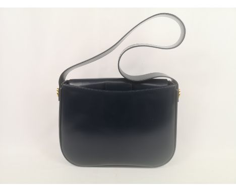 Celine blue leather handbag with gold coloured hardware, 27 x 21cms. Estimate £20-40.