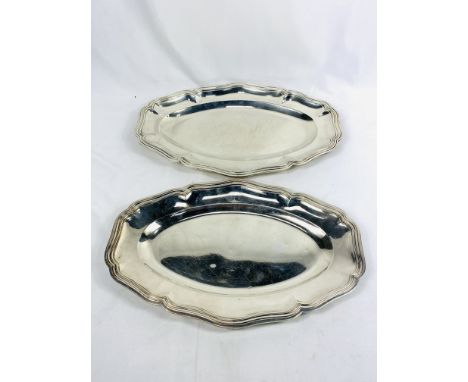 Two silver platters, one marked Boulenger, 1760g, largest 40 x 27cms. Estimate: £ 680-720