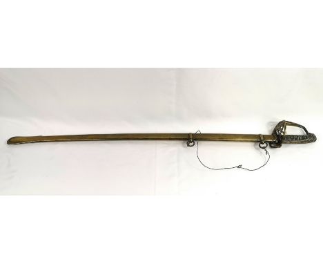 Victorian dress sword with indistinct marks to blade, housed in a brass scabbard, overall length 98cm. Estimate: £60-80