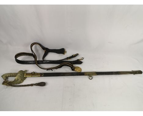 Early 20th century naval officers sword with leather and brass scabbard, total length 96cm. Estimate: £70-100