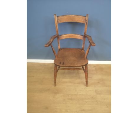 Elm ladder back open armchair with turned legs to stretchers, 58 x 60 x 94cms. Estimate £20-50.