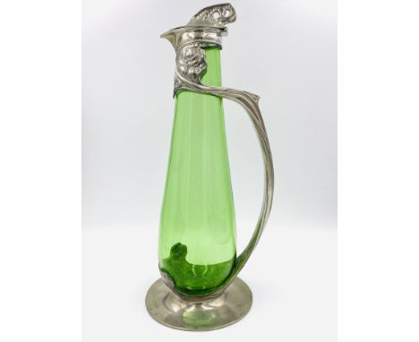 Tudric claret jug, circa 1903, 35.3 cm high. Pewter produced by W.H. Haseler, Birmingham for Liberty &amp; Co., London, Engla