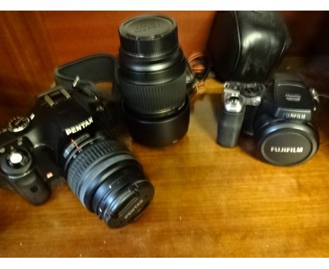 Pentax digital camera with 52mm lens plus Tamron lens and 2 other cameras