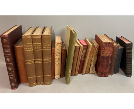 A collection of old books and dictionaries, including an Encyclopedia Britannica, books on arithmetic, geography &amp; french