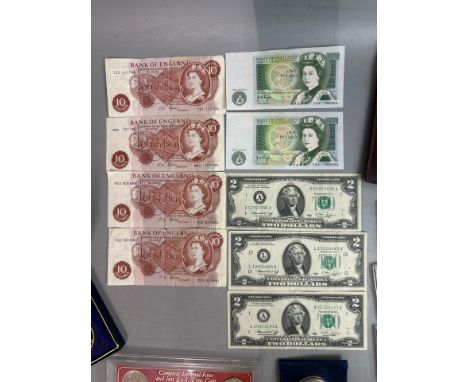 A large collection of mainly British coins and paper money including two crisp one pound note with sequential serial numbers,