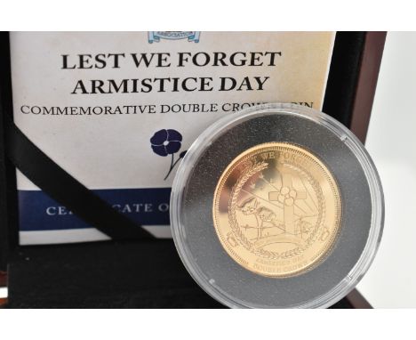 A 9CT COMMEMORATIVE DOUBLE CROWN PROOF COIN, commemorating Armistice day, dated 2015, stated weight 4 grams, in capsule with 