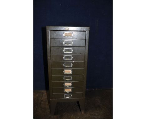 A VINTAGE METAL CHEST OF TEN FILE DRAWERS containing screws, nuts and bolts, and electrical fixings cabinet height 73cm