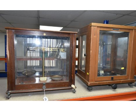 TWO SETS OF SCIENTIFIC WEIGHING SCALES, one set by Griffin and George and the other set by Baird and Tatlock, tallest case ap