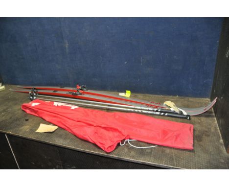 A PAIR OF VINTAGE TRAK MARATHON-C NOWAX SKI'S 200cm long with boot clips and a pair of poles