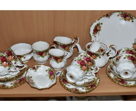 A TWENTY SIX PIECE ROYAL ALBERT 'OLD COUNTRY ROSES' TEA SET, comprising a small teapot (spout chipped, cover chipped and crac